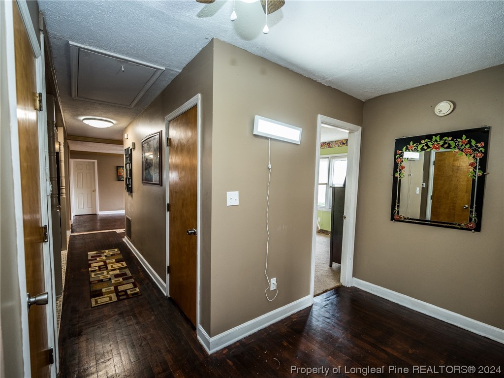 1982 Rowan Road, Unit R Lumberton, NC 28358 - Photo 42 of 43 a view of a hallway with wooden floor
