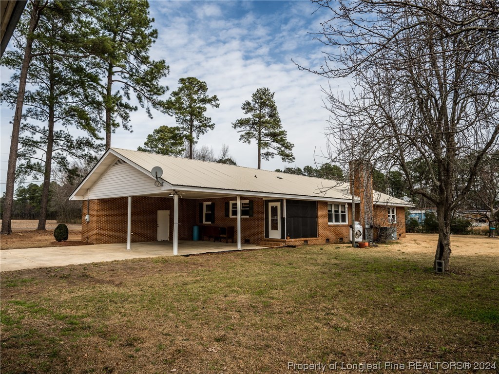 1982 Rowan Road, Unit R Lumberton, NC 28358 - Photo 6 of 43 a front view of a building with a garden