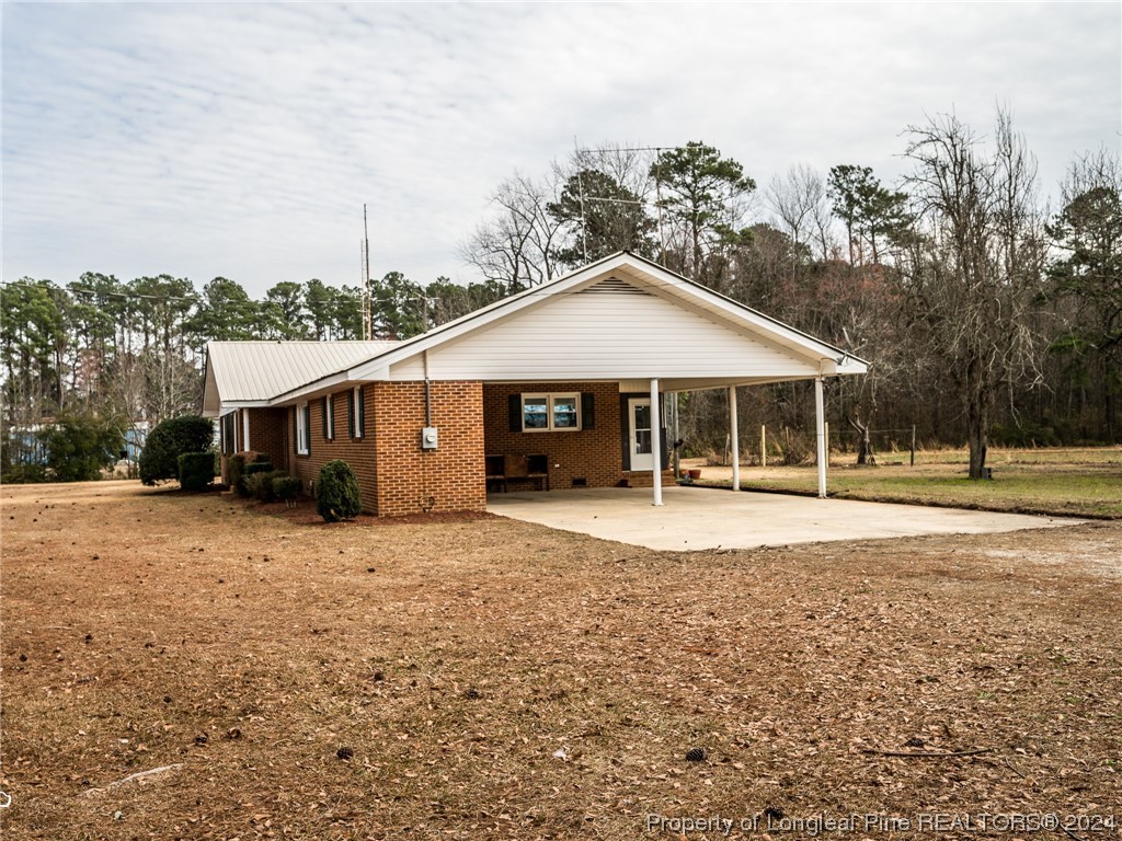 1982 Rowan Road, Unit R Lumberton, NC 28358 - Photo 8 of 43 a front view of a house with a garden