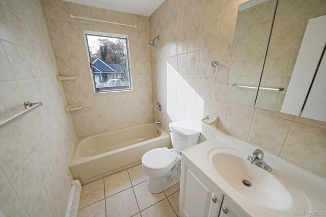 a bathroom with a sink a toilet and a bathtub