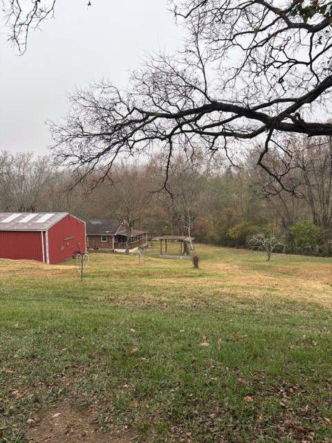 435 Dry Creek Road Goodlettsville, TN 37072 - Photo 26 of 34 a backyard of a house with lots of green space