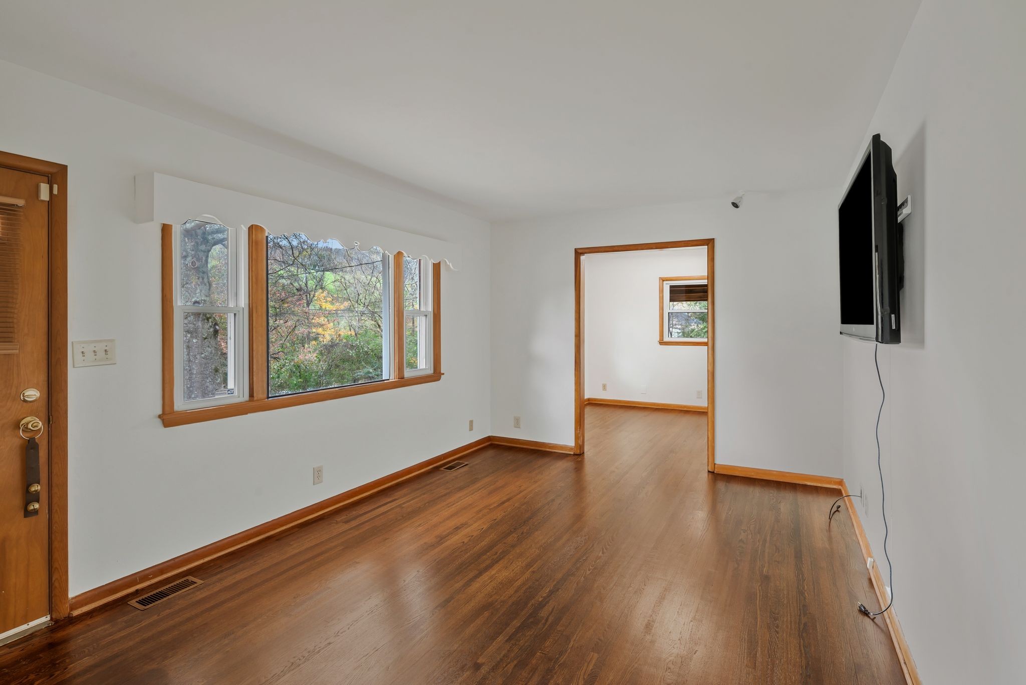 435 Dry Creek Road Goodlettsville, TN 37072 - Photo 3 of 34 a view of an empty room with window and wooden floor