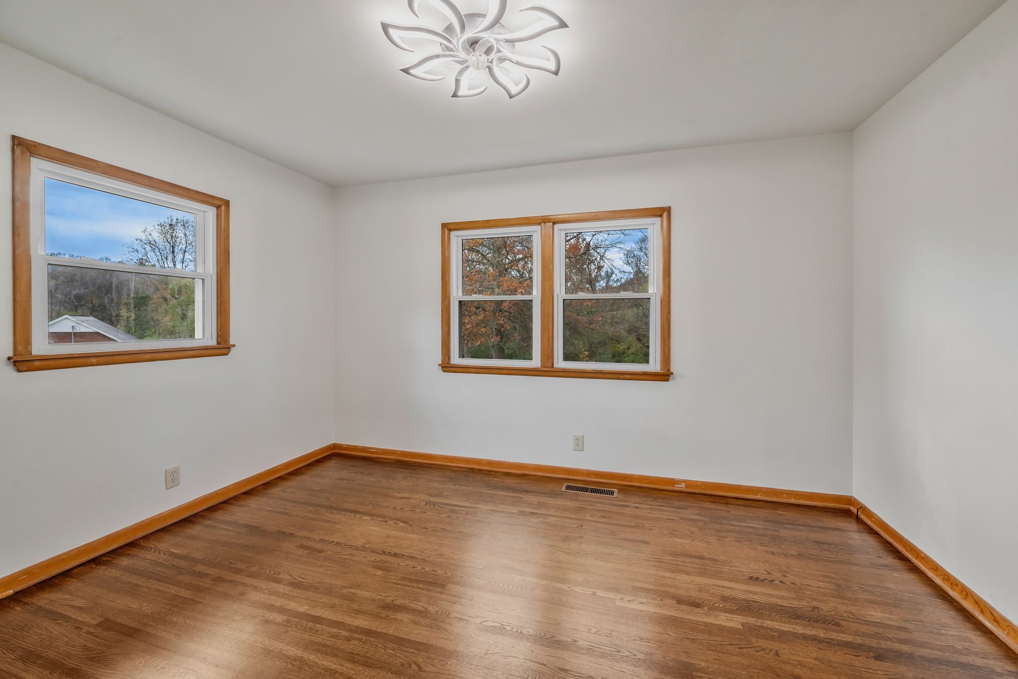 435 Dry Creek Road Goodlettsville, TN 37072 - Photo 7 of 34 a view of an empty room with wooden floor and a window