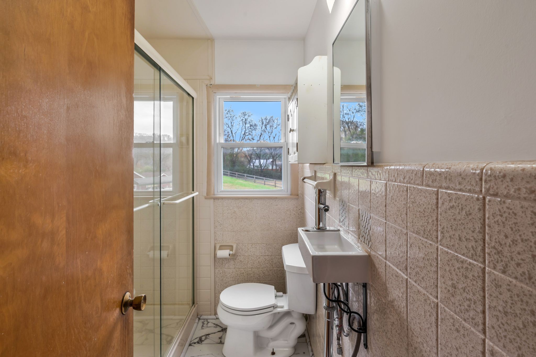 435 Dry Creek Road Goodlettsville, TN 37072 - Photo 9 of 34 a bathroom with a toilet a sink and a window