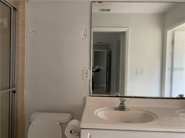 a bathroom with a sink and a toilet