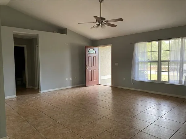 a view of an empty room with a window