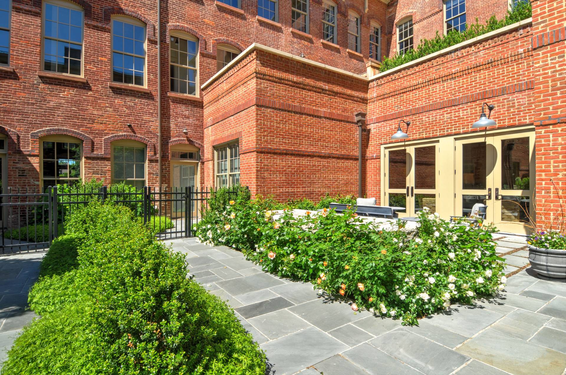 4 Sage Street Sag Harbor, NY 11963 - Photo 11 of 19 front view of a brick house with a large windows