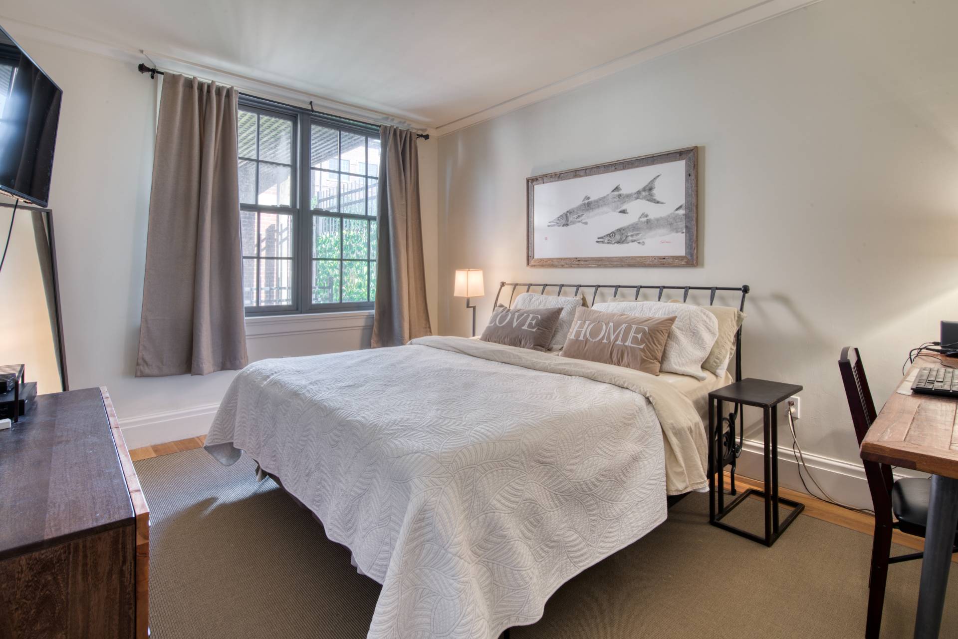 4 Sage Street Sag Harbor, NY 11963 - Photo 4 of 19 a bedroom with a bed and a flat screen tv