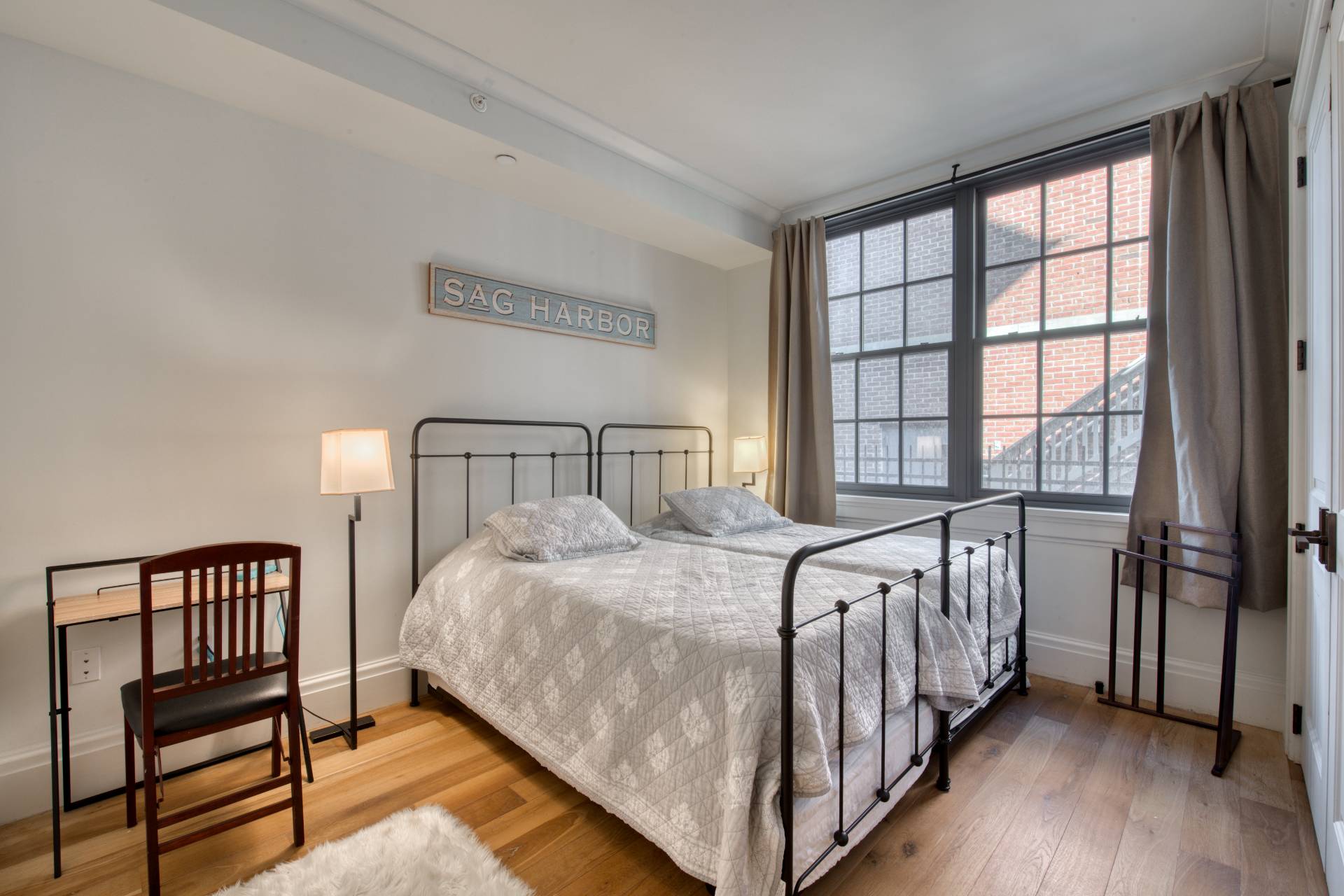 4 Sage Street Sag Harbor, NY 11963 - Photo 6 of 19 a bedroom with a bed and a window