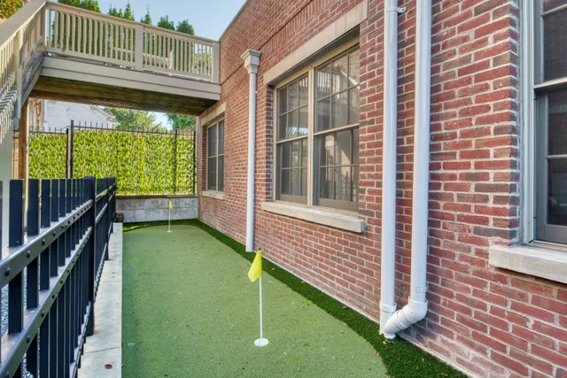 front view of a brick house with a large windows