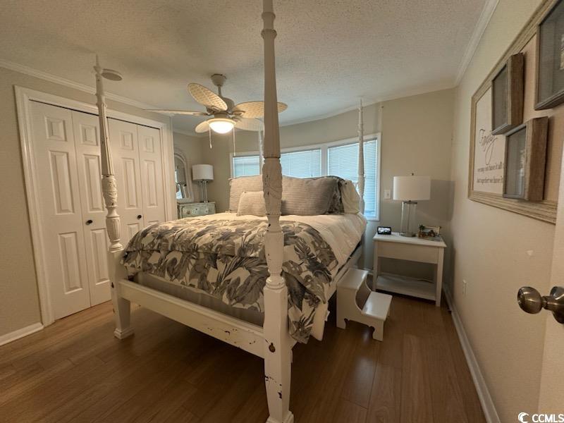 315 Inlet Road Murrells Inlet, SC 29576 - Photo 14 of 19 Bedroom featuring crown molding, a textured ceiling, ceiling fan, and dark wood finished floors