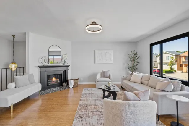 a living room with furniture and a table