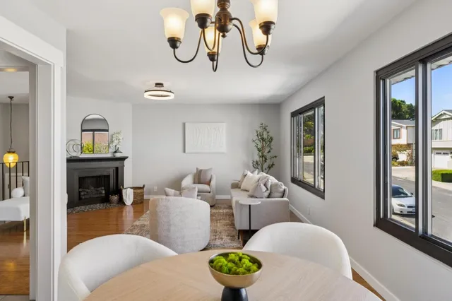 a living room with furniture potted plant and a potted plant