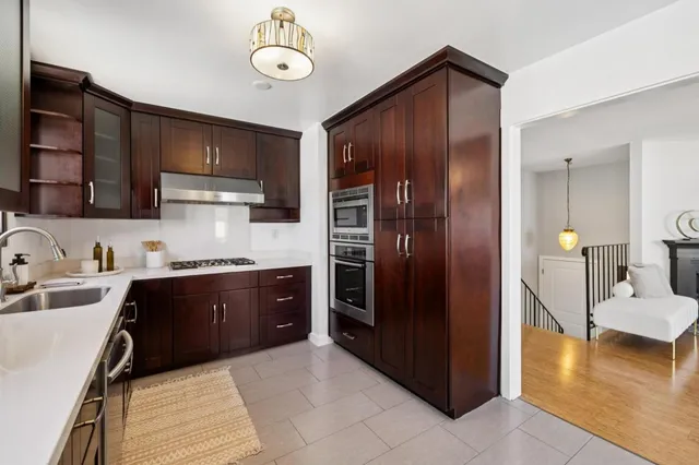 a backyard of a house with lots of green space and outdoor seating