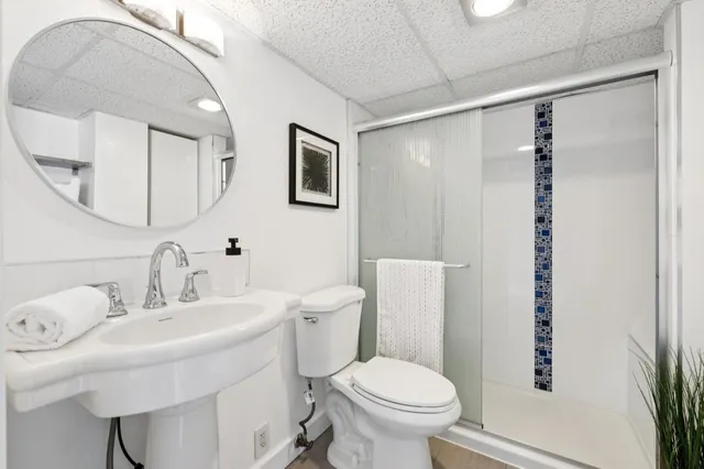 a living room with lots of furniture and white walls