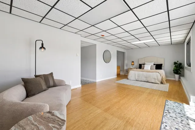 a group of people sitting in front of retail shop