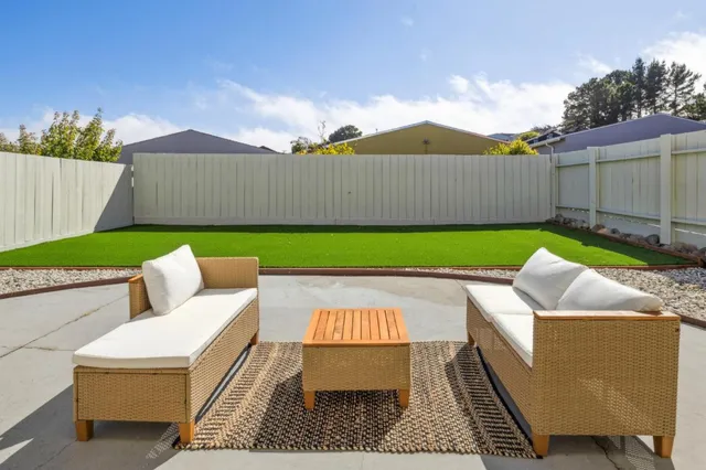 a front view of a house with parking area