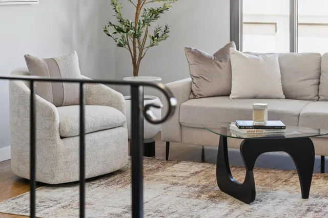 a living room with furniture and a fireplace