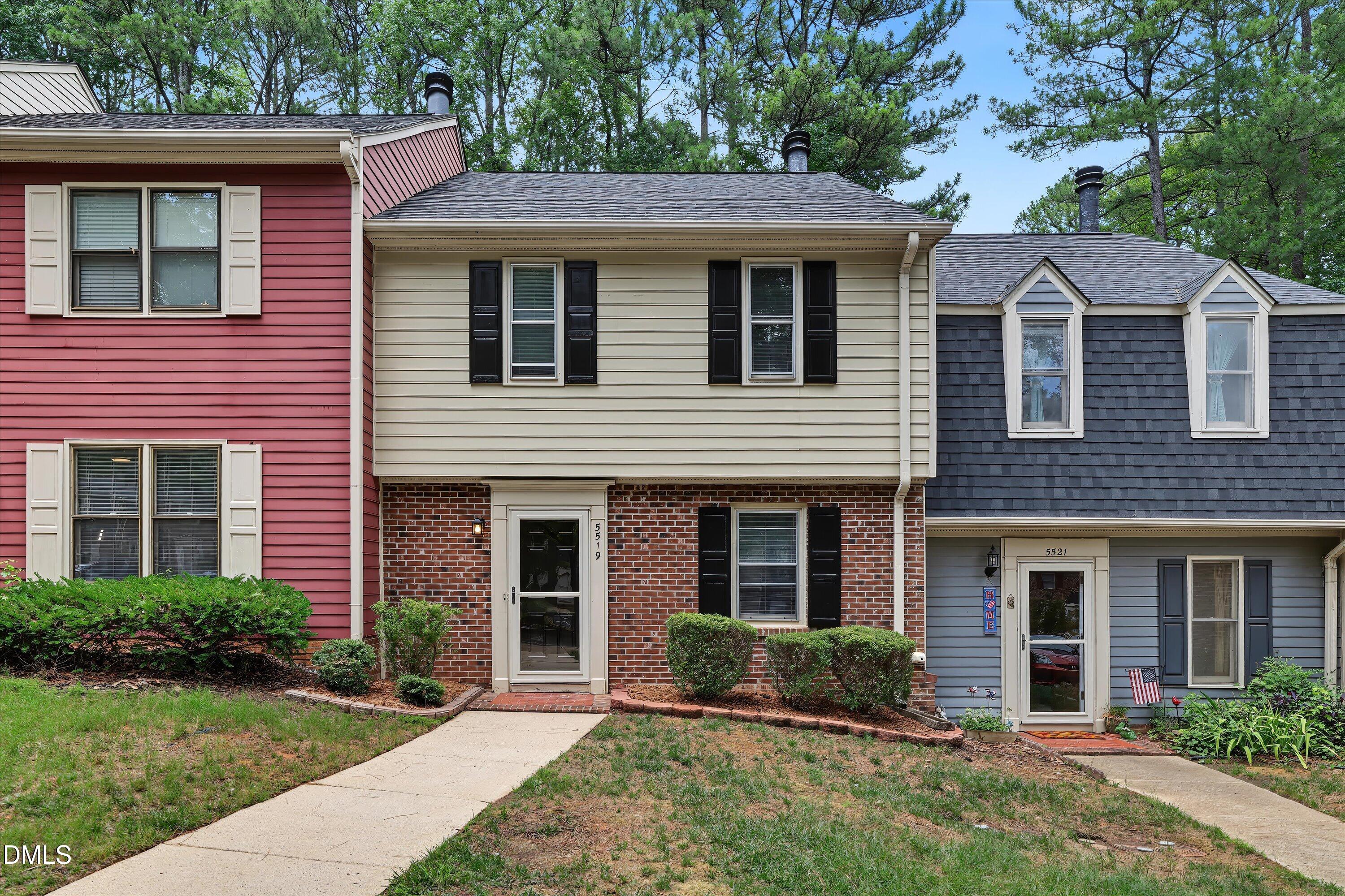 5519 Hamstead Crossing Raleigh, NC 27612 - Photo 1 of 33 a front view of a house with a yard and garage