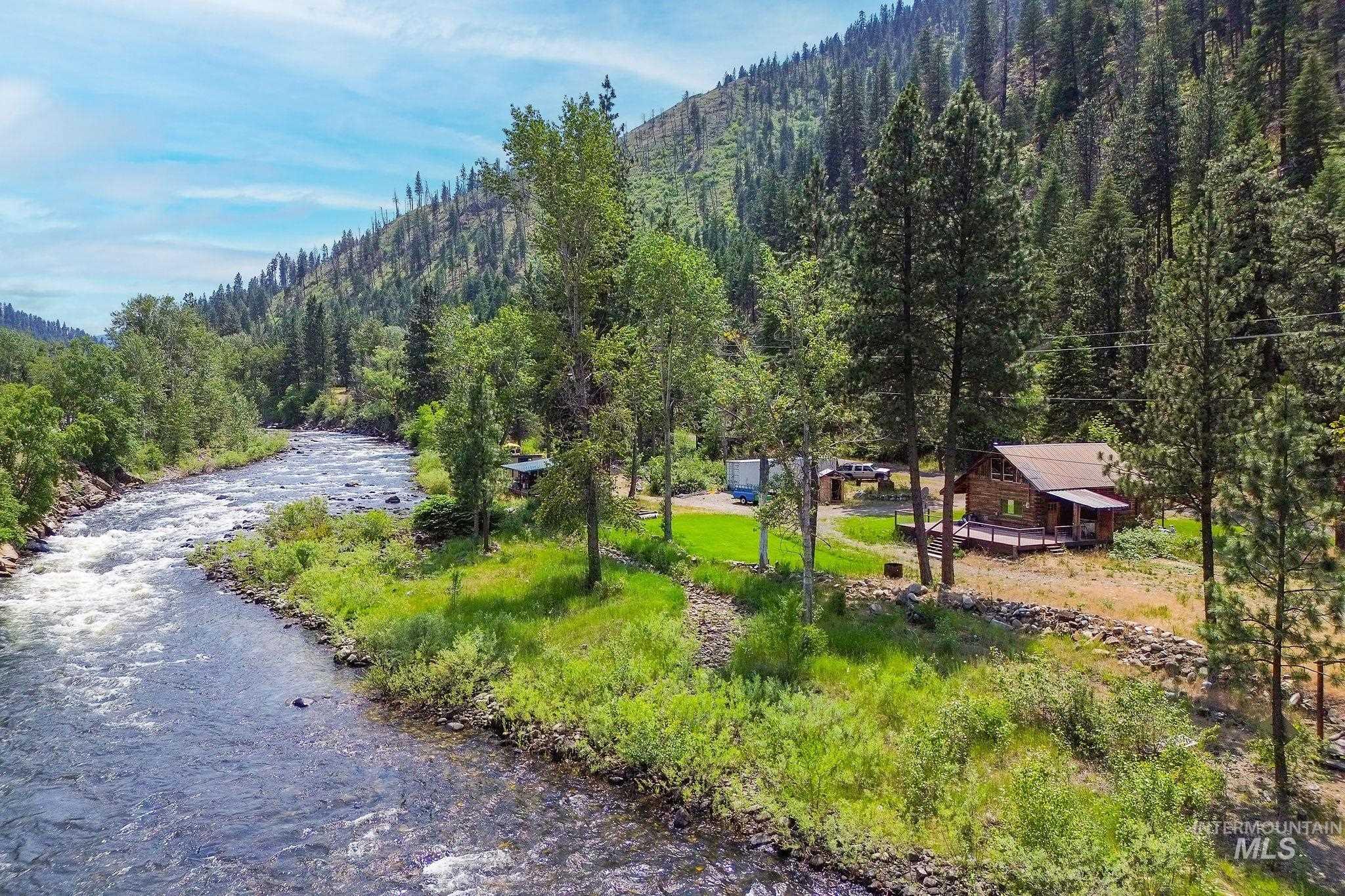 Surrounding community featuring a wooded view and a mountain view