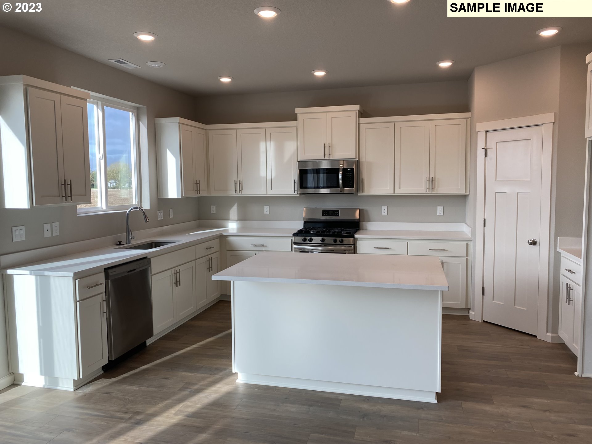 1020 Marie Street Mount Angel, OR 97362 - Photo 4 of 15 a kitchen with kitchen island a sink stainless steel appliances and cabinets