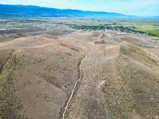 600 East E Street Moroni, UT 84646 - Photo 32 of 38 Expansive undeveloped terrain featuring a winding dirt path and sparse vegetation