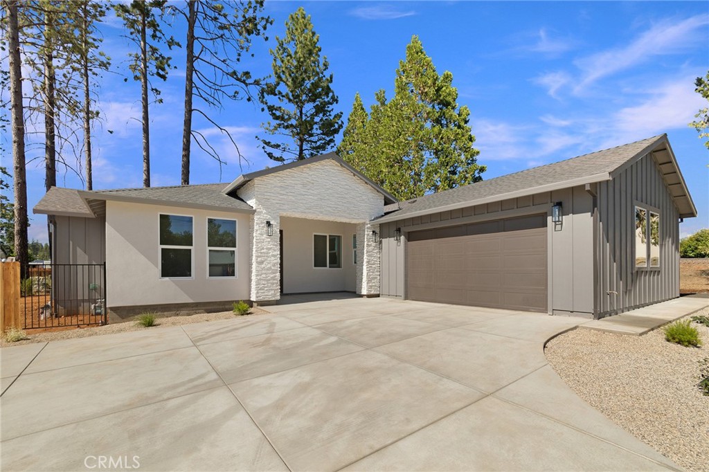 5710 Pentz Road Paradise, CA 95969 - Photo 1 of 1 a front view of a house with a garden