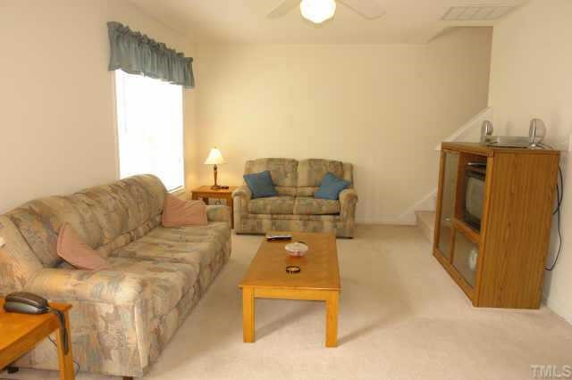 2220 Violet Court Raleigh, NC 27604 - Photo 2 of 10 a living room with furniture and a flat screen tv