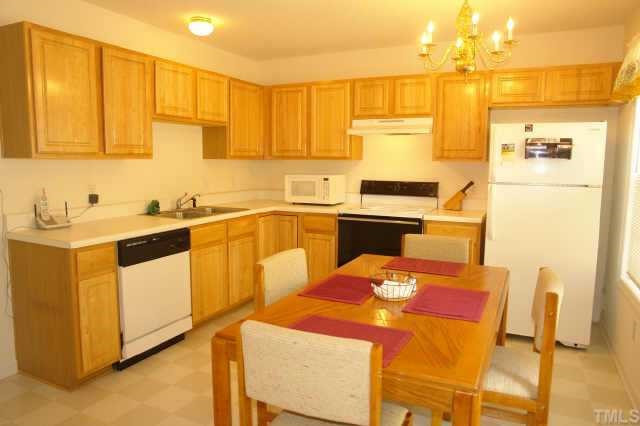 2220 Violet Court Raleigh, NC 27604 - Photo 4 of 10 a kitchen that has a sink and chairs