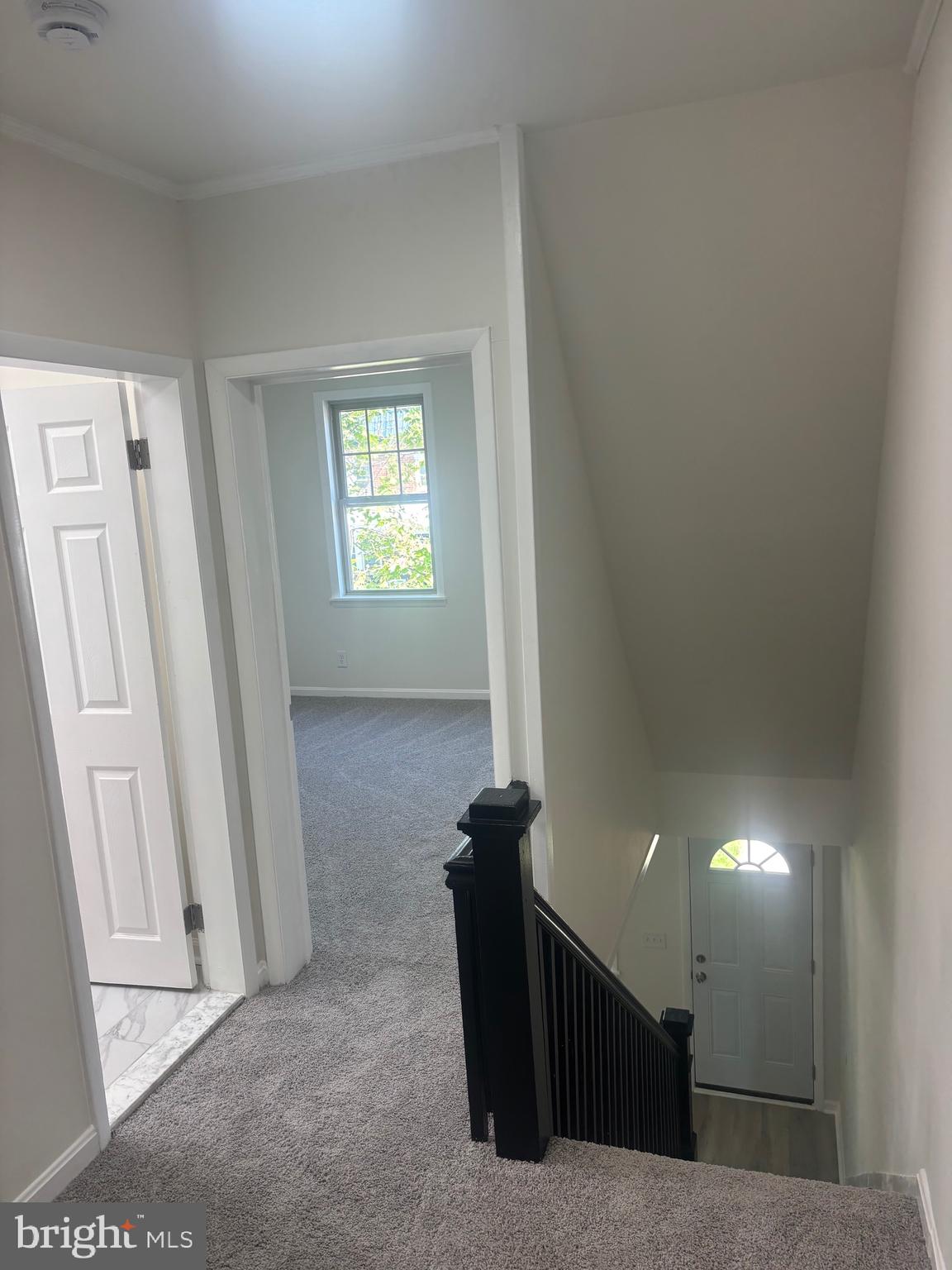 6769 Woodley Road Baltimore, MD 21222 - Photo 24 of 27 a view of a hallway with front door