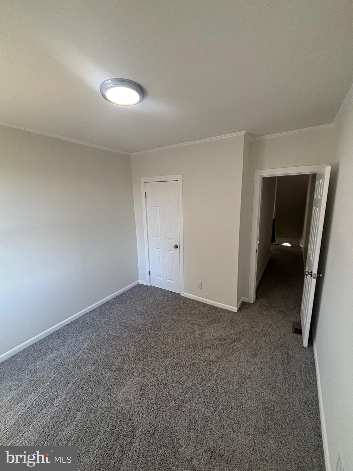6769 Woodley Road Baltimore, MD 21222 - Photo 26 of 27 a view of an empty room and closet area