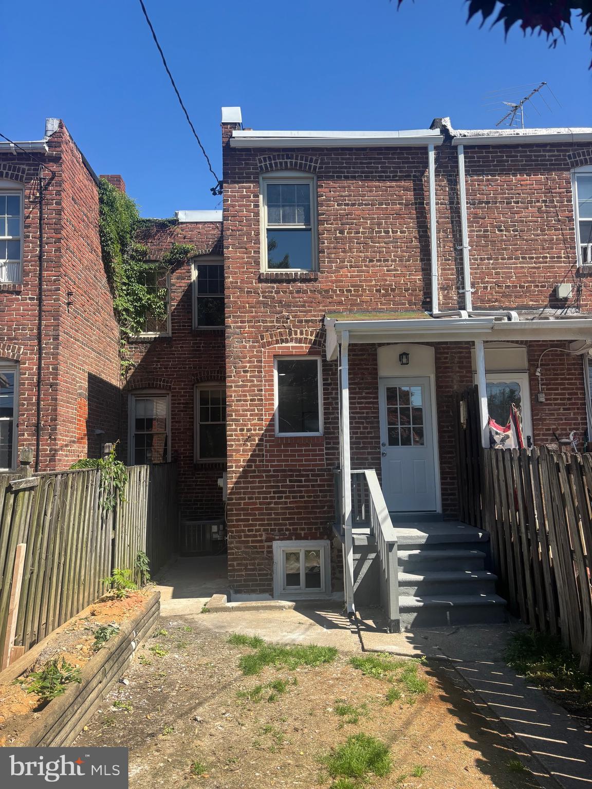 6769 Woodley Road Baltimore, MD 21222 - Photo 27 of 27 a view of a house with a patio