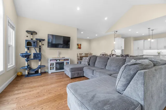 a bedroom with a bed and a potted plant