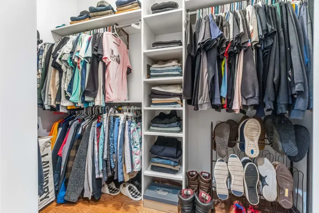 a kitchen with granite countertop a refrigerator and a sink