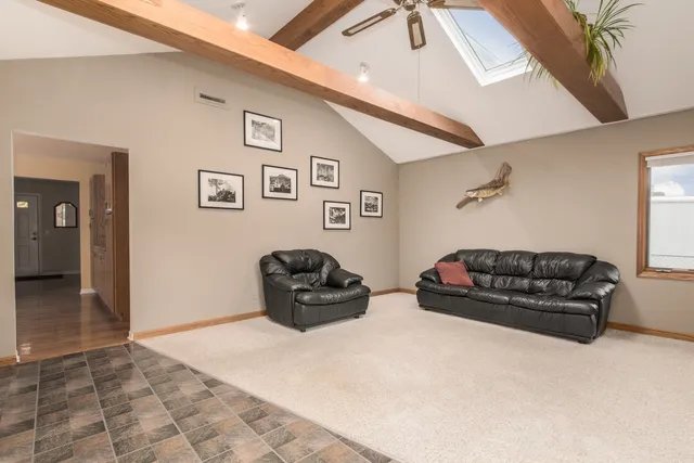 a view of a house with a yard and garage