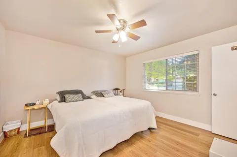a bedroom with a bed and window