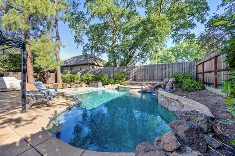 a view of a swimming pool with a patio