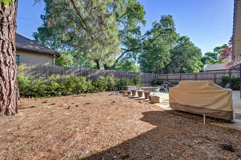 a view of a backyard with sitting area