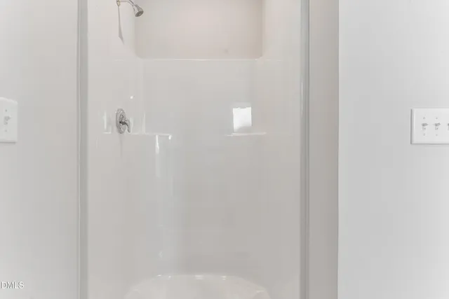 a bathroom with 2 sink and a mirror