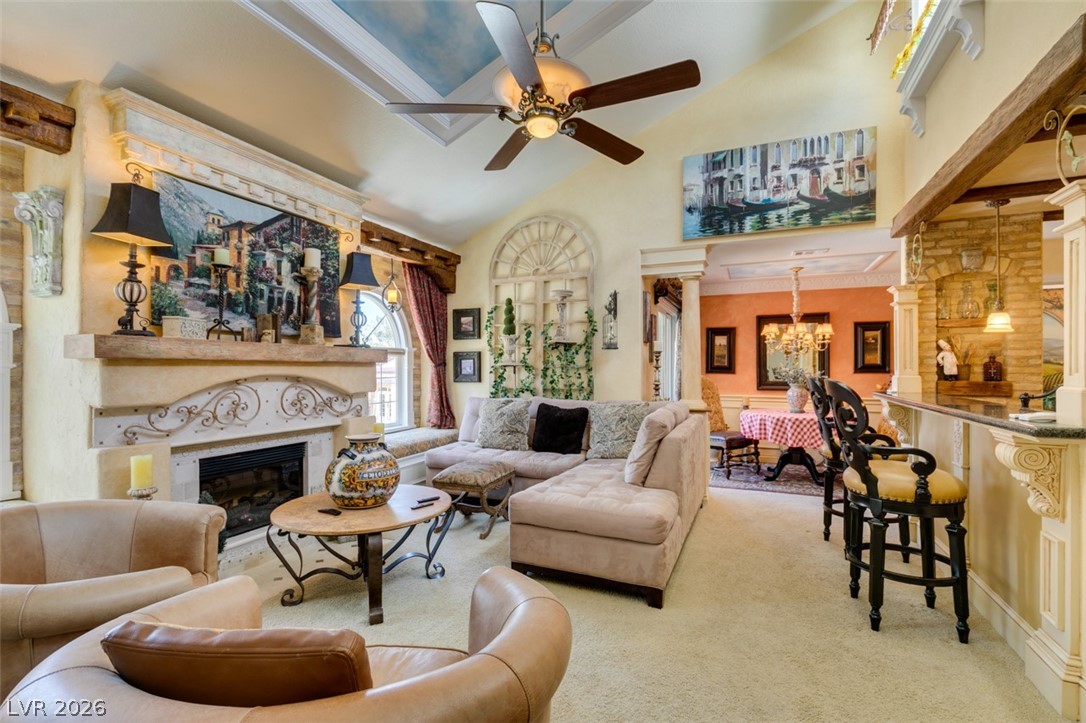 9325 West Desert Inn Road, Unit 244 Las Vegas, NV 89117 - Photo 4 of 55 A striking fireplace forms the heart of this well-lit living room, featuring a high vaulted ceiling and decorative archways.