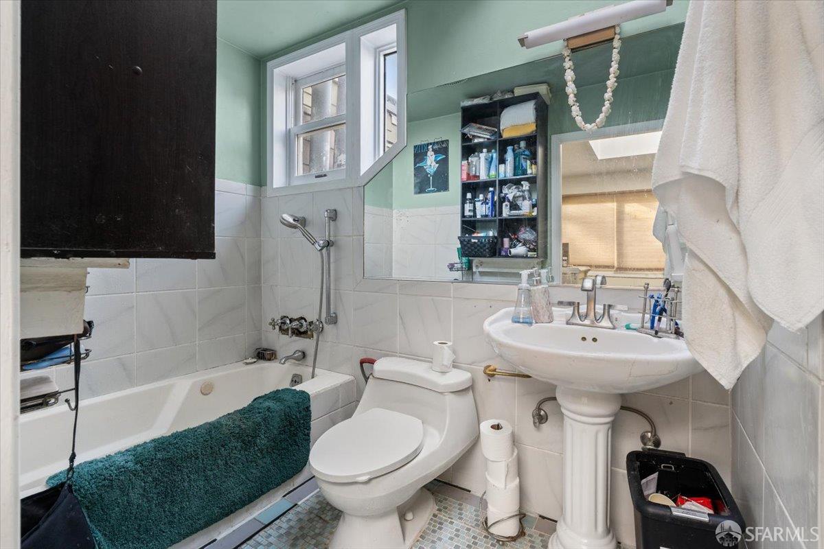 130 Ripley Street San Francisco, CA 94110 - Photo 26 of 69 a bathroom with a sink toilet and shower