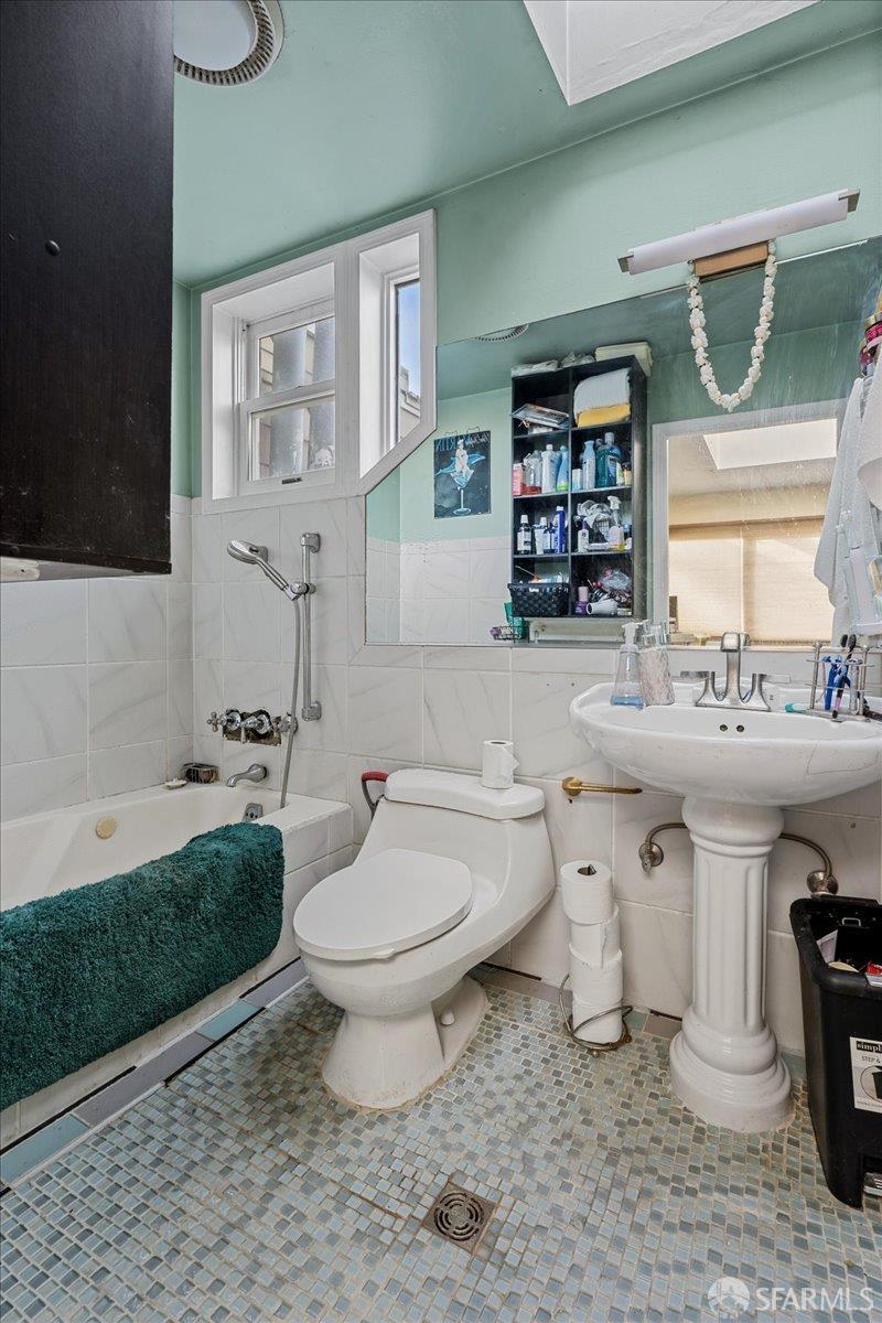 130 Ripley Street San Francisco, CA 94110 - Photo 27 of 69 a bathroom with a sink toilet and a mirror