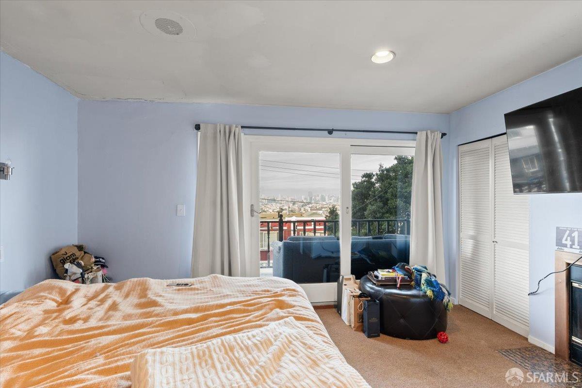 130 Ripley Street San Francisco, CA 94110 - Photo 38 of 69 a bedroom with a bed and a window