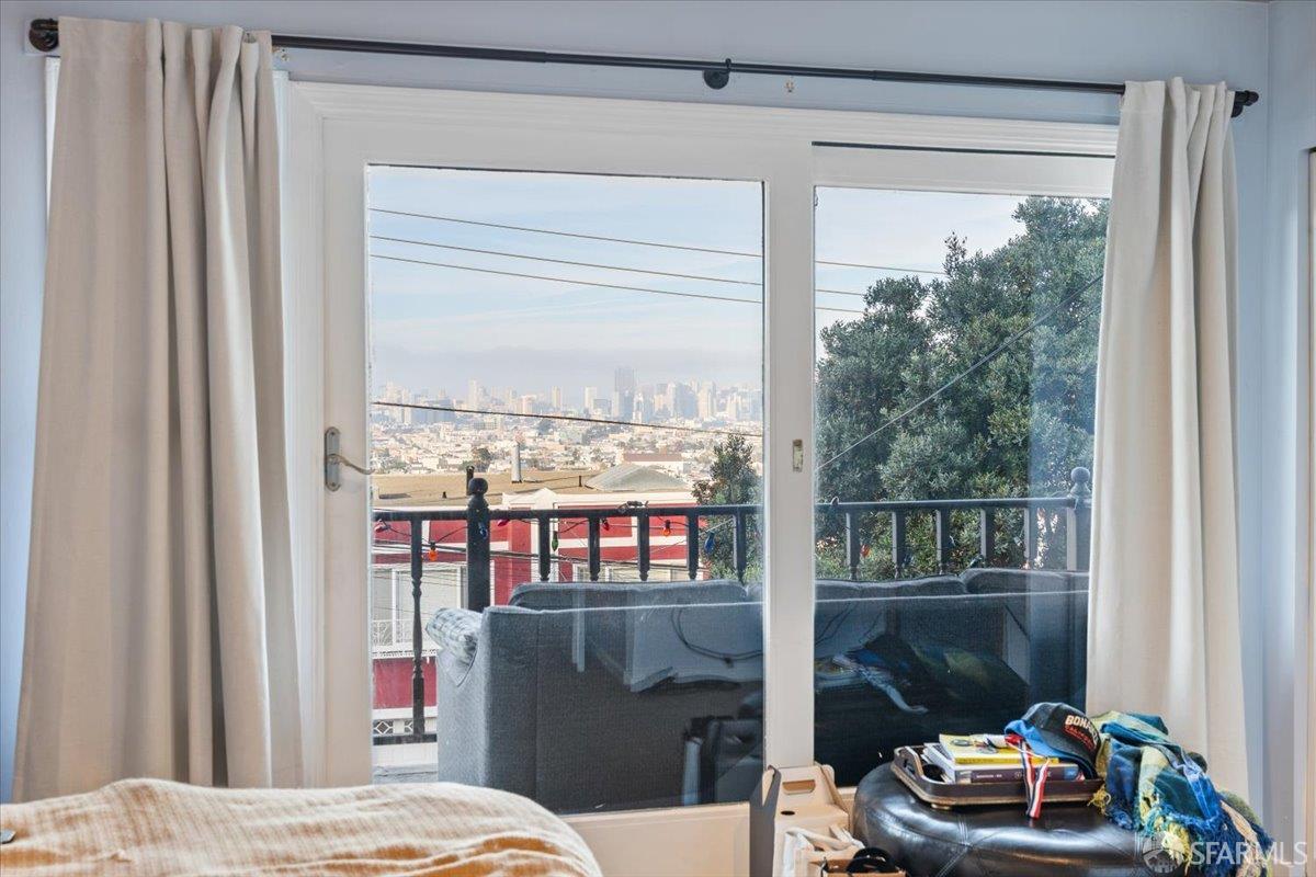130 Ripley Street San Francisco, CA 94110 - Photo 39 of 69 a bedroom with a bed and a window