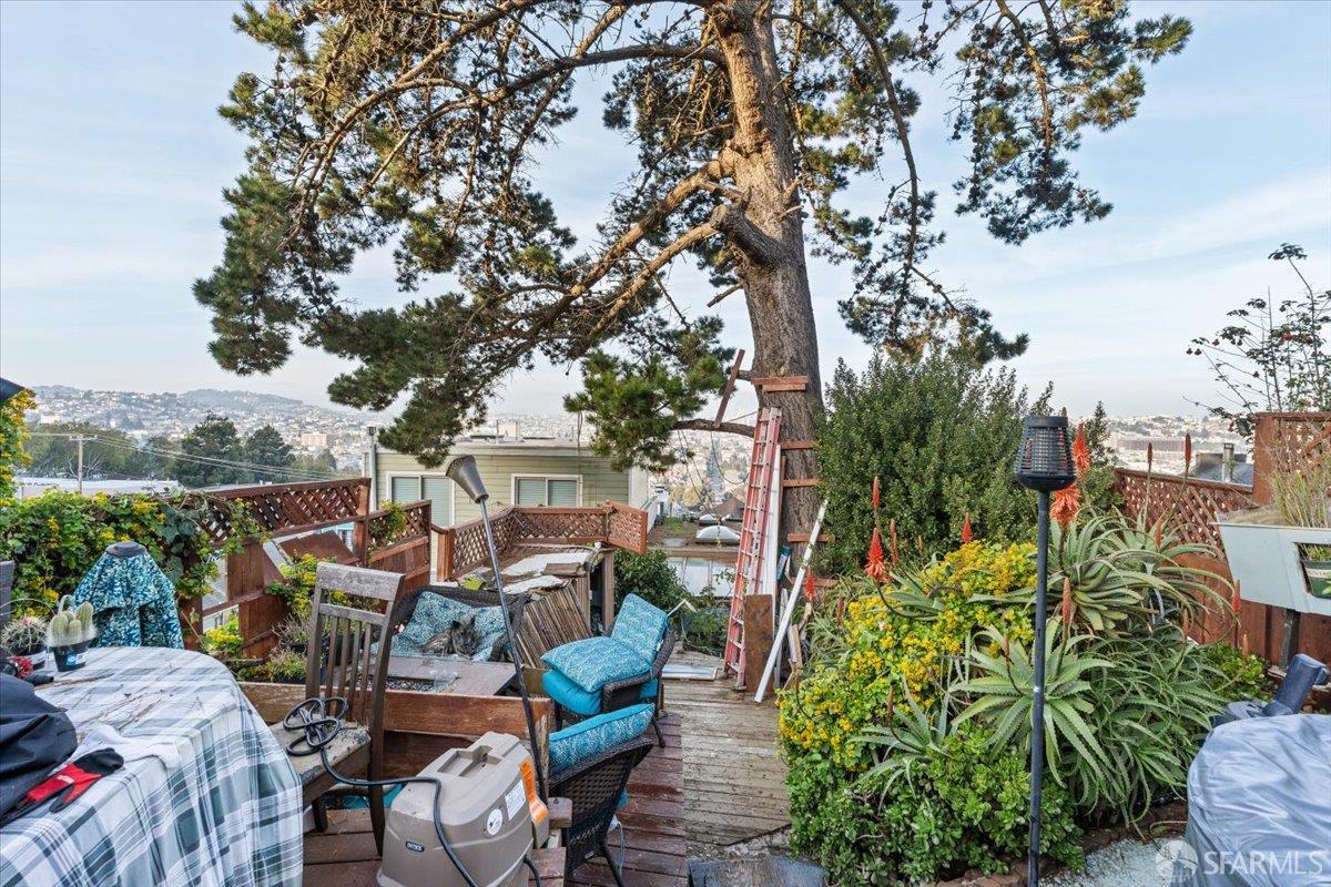 130 Ripley Street San Francisco, CA 94110 - Photo 45 of 69 a view of a patio with table and chairs and potted plants