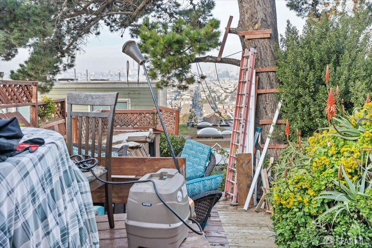 130 Ripley Street San Francisco, CA 94110 - Photo 47 of 69 a view of a patio with table and chairs and potted plants