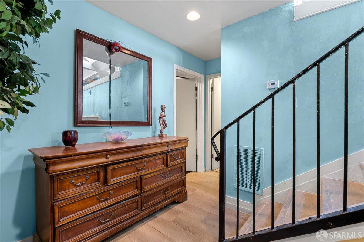 130 Ripley Street San Francisco, CA 94110 - Photo 7 of 69 a view of room with wooden floor and stairs
