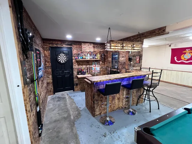 a view of a room with furniture and a chandelier