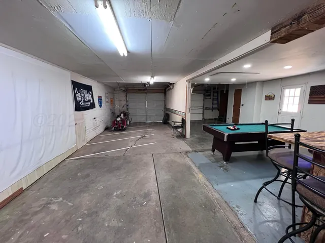 a room with furniture and a ceiling fan