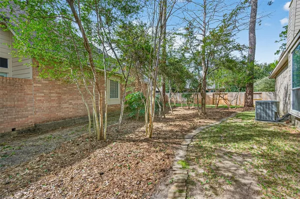 a view of a yard with a tree